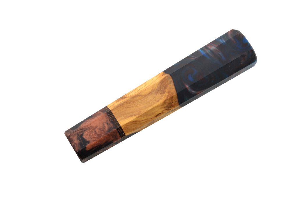 The Custom Wa-Handle #614 - 142mm (Standard) by Made in Turkey features a handcrafted design with a natural wood section reminiscent of an olive wood knife handle and glossy dark resin swirls, shown on a white background.