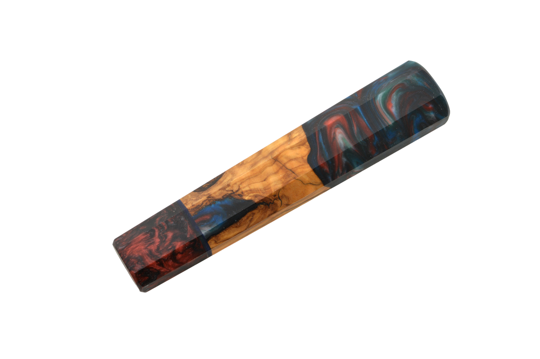 The Custom Wa-Handle #619 (141mm Standard) by Made in Turkey is a rectangular resin and olive wood hybrid blank with swirling red, blue, and black patterns—perfect for crafting knife handles. Shown on a white background.