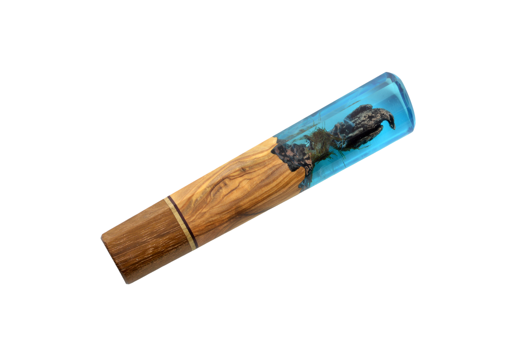 The Custom Wa-Handle #631 - 142mm (Standard) by Made in Turkey features a handcrafted wooden base, a blue resin upper section with embedded dark wood—evoking the look of a custom knife handle. Shown against a plain white background.